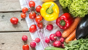 Nutrition in Addiction Recovery, colorful vegetables on wooden table