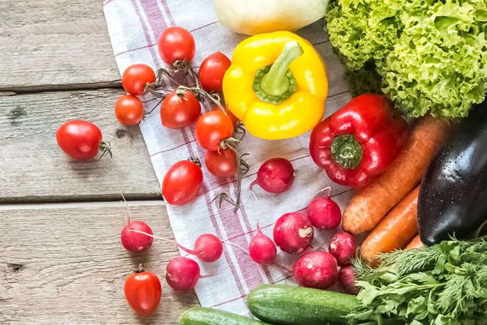 Nutrition in Addiction Recovery, colorful vegetables on wooden table