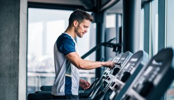Stress in Addiction Recovery, Stress Management in Addiction Recovery, Healthy Ways to Cope with Stress, man on treadmill at gym - stress